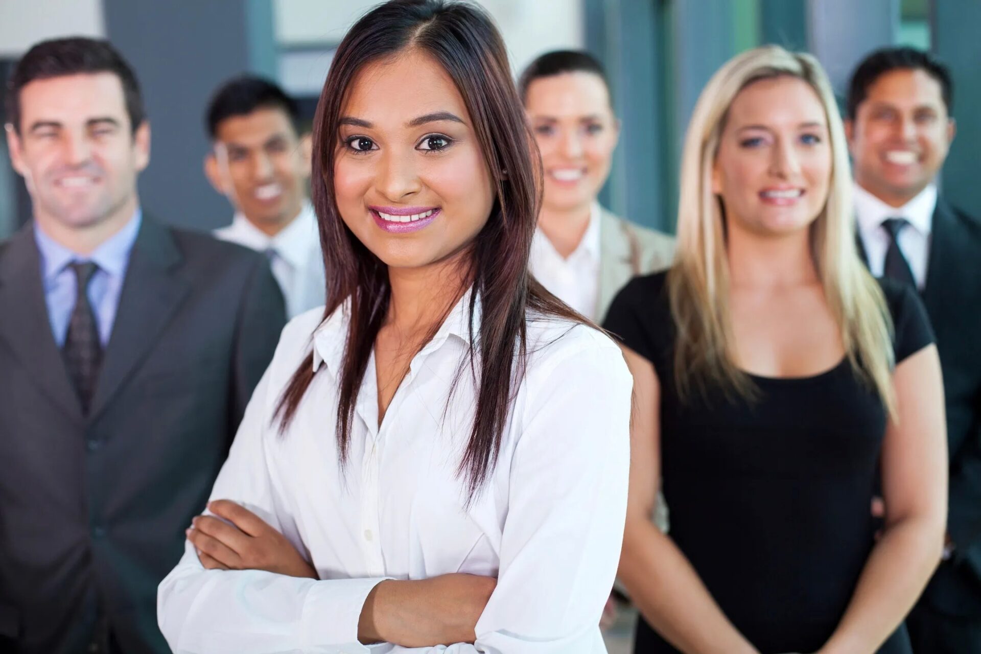 A group of people standing in front of each other.